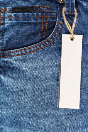 Close-up of jeans pants with paper tagの写真素材