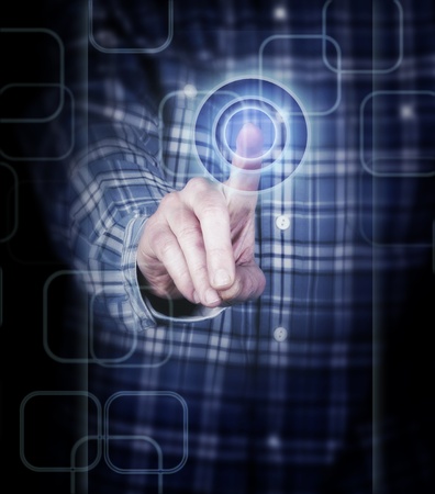 hand pushing a button on a touch screen interfaceの写真素材