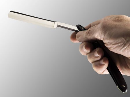 old straight razor held by one hand の写真素材