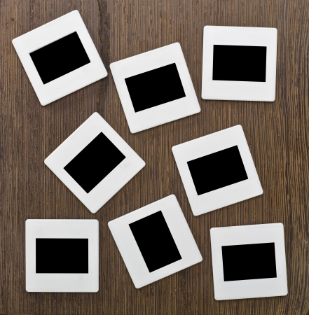 Slides on wooden backgroundの写真素材