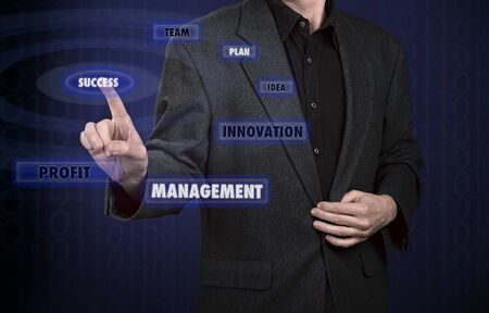 Businessman pressing virtual media type of buttonsの写真素材