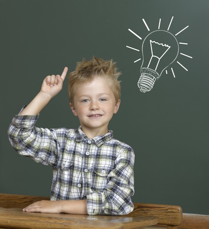  Cheerful smiling child at the blackboard.の写真素材