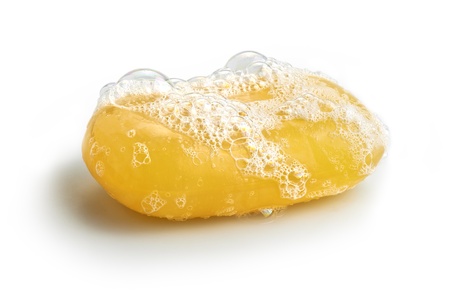 Yellow soap bubble of isolation on a white backgroundの写真素材