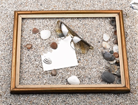 Shells, starfish ,blank paper sheet ,sunglasses and frame