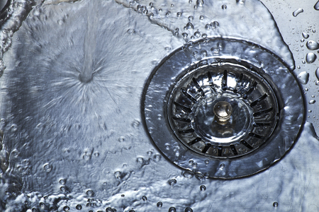 Water and droplets in sinkの写真素材