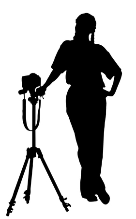 portrait silhouette of a young woman photographer holding a camera   clipping path  の写真素材