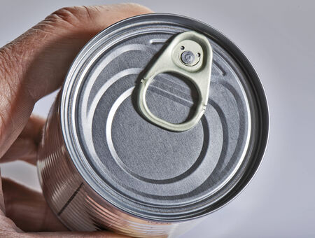 Silver color cover from can with hand