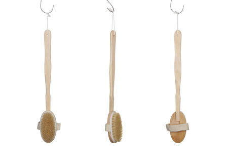 Close up image of wooden body brush against white backgroundの写真素材