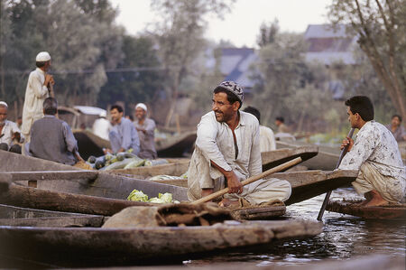 Srinagar, Lake Dal, Jammu and Kashmir, India - November 29, 2001: Unidentified Kashmiri men smiling at the morning floating market on Dal Lake, major tourist attraction, in Kashmirのeditorial素材