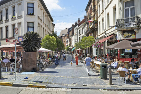 BRUSSELS,BELGIUM- JULY, 16 2014: Brussels city life at lunch time. Square Place Jourdan at Etterbeek near European Commission and EU-district in Brussels. Typical daily lunch time scene in Brussels. At this places are several restaurants and bars. のeditorial素材