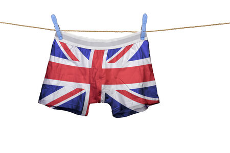 Underwear with the UK flag on a string against white backgroundの写真素材