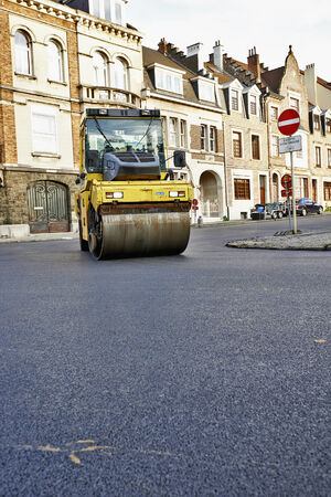 BRUSSELS, BELGIUM - NOVEMBER 29, 2014:  Heavy Vibration roller compactor at asphalt pavement works for road repairing on November 29, 2014 in Brussels, Belgiumのeditorial素材