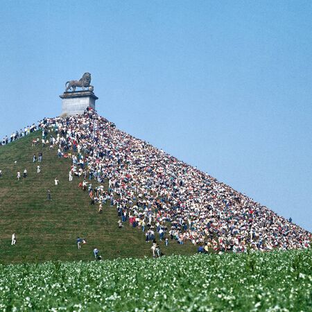 WATERLOO, BELGIUM -CIRCA 1990: Public holds the famous Lion memorial during the historical reenactment of the Battle of Waterloo, on  June 1990 in Waterloo, Belgiumのeditorial素材