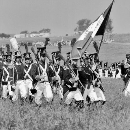 WATERLOO, BELGIUM -CIRCA 1990: Actors in costume during the reenactment of the Battle of Waterloo that in 1815 ended Napoleon's imperial dream, on  June 1990 in Waterloo, Belgiumのeditorial素材