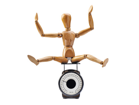 Happy wooden dummy and measuring instrument - Clipping pathの写真素材