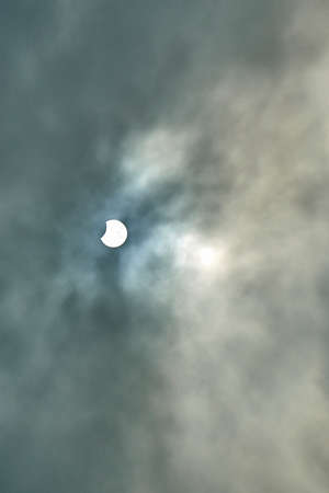 End and Partial Solar Eclipse on a Cloudy Day in Brussels on 20 march 2015