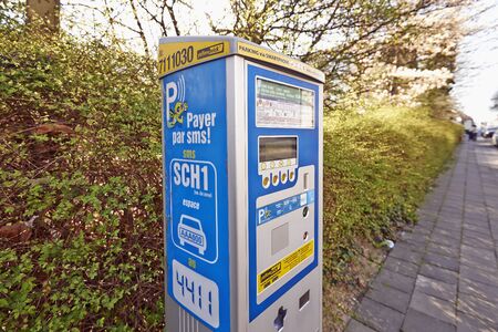 BRUSSELS, BELGIUM - APRIL 15, 2015:  Brussels powered solar parking meter. Parking solutions have been growing in importance to deal with increasing congestion of parking spaces.のeditorial素材