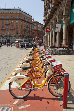 MILAN ITALY JUNE November 2015: A Row of city bikes for rent at The Golden Bike sharing station Piazza Duomo in Milan. symbol of ecology and alternative energy mobilityのeditorial素材