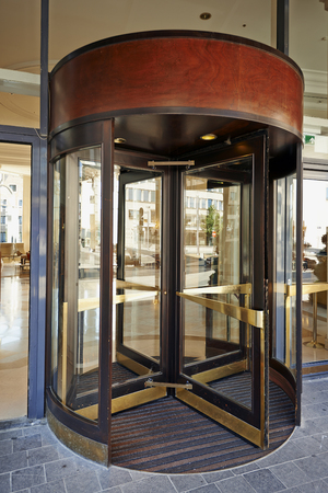 BRUSSELS,BELGIUM - 29 AUGUST 2015: The main entrance and the Glass revolving door at Hotel Hilton Grand Place in Brussels on 29 August 2015のeditorial素材