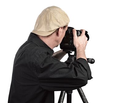Photographer looking through camera isolated on white with clipping path