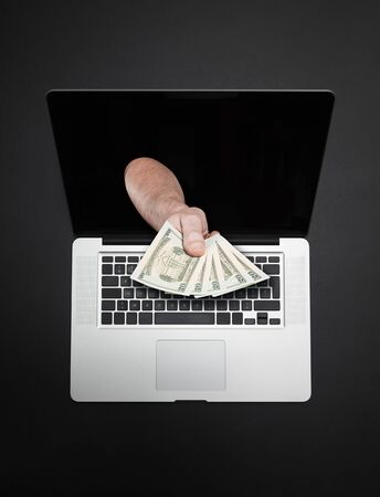 Getting money from laptop monitor screen - Online Transaction, Online Banking theme.