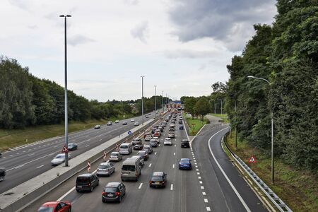 BERTEM, BELGIUM - AUGUST 12, 2014: Picture shows lots of car stucked in Bertem cloverleaf, on the highway E40, as works in august 2014のeditorial素材