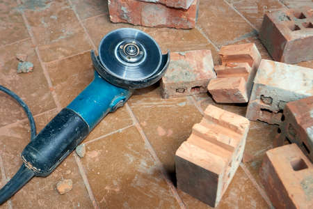 Saw for bricklayer laying on the groundの写真素材