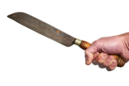 Male Hand holding a rusty butcher knife isolated on white backgroundの写真素材