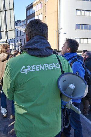 BRUSSELS, BELGIUM - January 20, 2017: Greenpeace organise demonstration for Bridges Not Walls: anti-Trump protesters have dropped banners on the bridge between Molenbeek and Brussels centerのeditorial素材