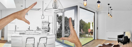 Planned renovation of a Open modern kitchen from loft with view on a lush gardenの写真素材