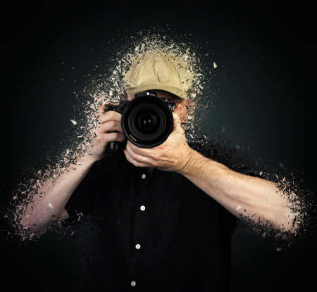 Men's hands held camera shatteredの写真素材