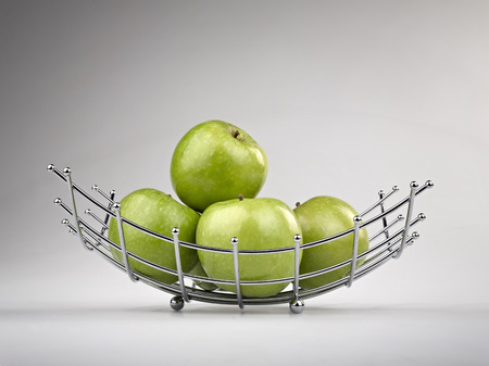 Modern style fruit basket made of steel wireの写真素材