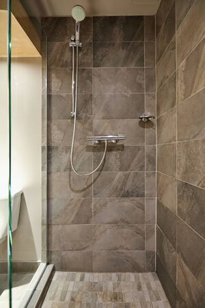 Rain shower bathroom stone tile backgroundのeditorial素材