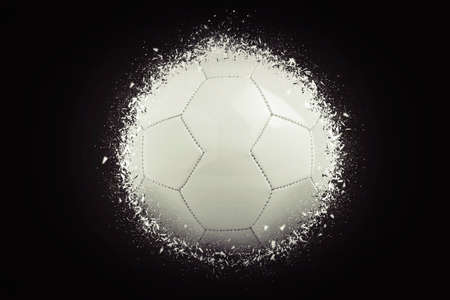 soccer ball explode on black backgroundの写真素材