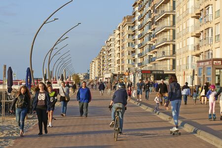 DE PANNE, BELGIUM - JULY 03, 2017: Promenade of the Belgian Seaside resort De Panne with lot of people walkingのeditorial素材