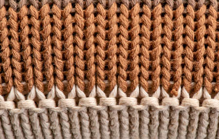 Close-up on the texture in wool from a sepia pull overの写真素材