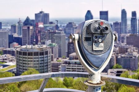 Old vintage binocular on the deck with view on Montreal cityのeditorial素材