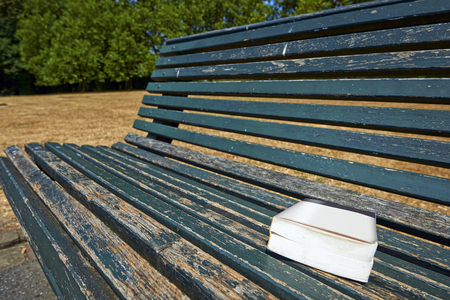 Book on a park bench. Concept for suggest a lovely book for other peopleの写真素材