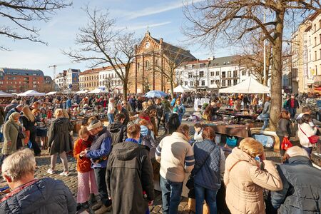 BRUSSELS, BELGIUM - FEBRUARY 17, 2019: lot of people enjoy a sunny winter day at the Flea market from de Place du Jeu de Balle on february 17, 2019 in Brussels. The market takes place daily and is popular among local people and tourists.のeditorial素材