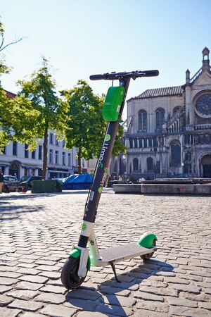 Brussels, Belgium - May 15, 2019:  Black and green Electric scooter for rent in Brussels, Belgiumのeditorial素材