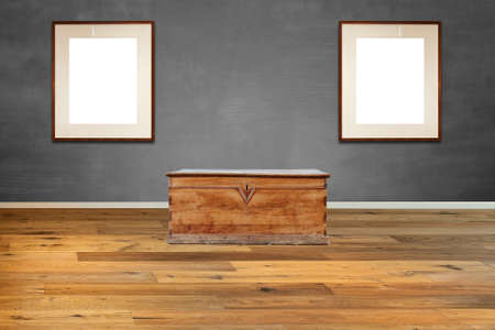 Old-fashioned wooden chest against textured Gray wall