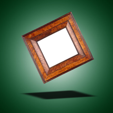 Floating Antique and vintage square frame in walnut wood on green gradient backgroundの写真素材
