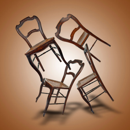 Floating wooden chairs with cane with shadows on brown gradient backgroundの写真素材