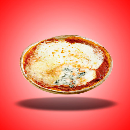 Floating Pizza four cheese on red radial gradient backgroundの写真素材