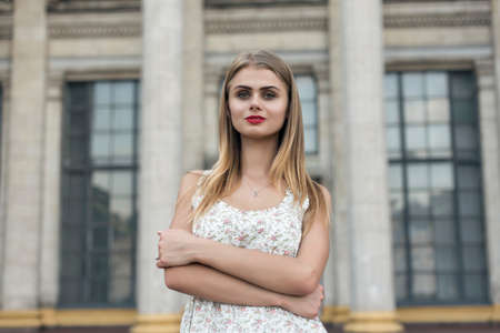 blonde in a summer white dressの写真素材
