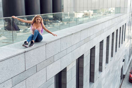 Blonde in different places of the cityの写真素材