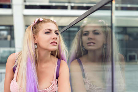 Blonde in different places of the cityの写真素材