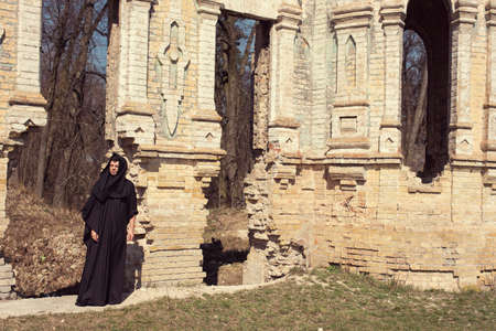 A lonely monk in an abandoned old castleの写真素材