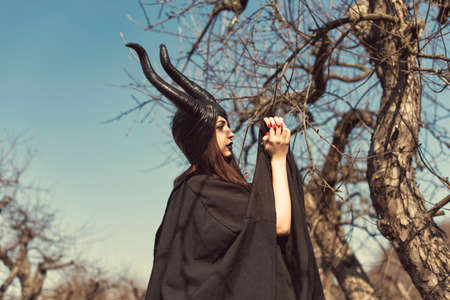 Brunette in a spring apple orchardの写真素材