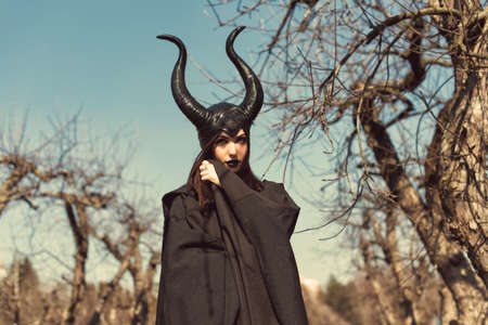 Brunette in a spring apple orchardの写真素材